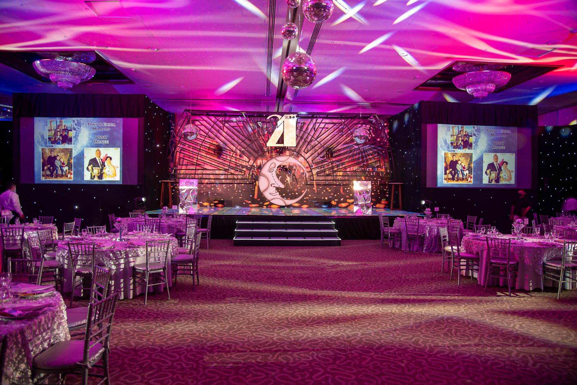 A corporate stage under warm architectural lighting