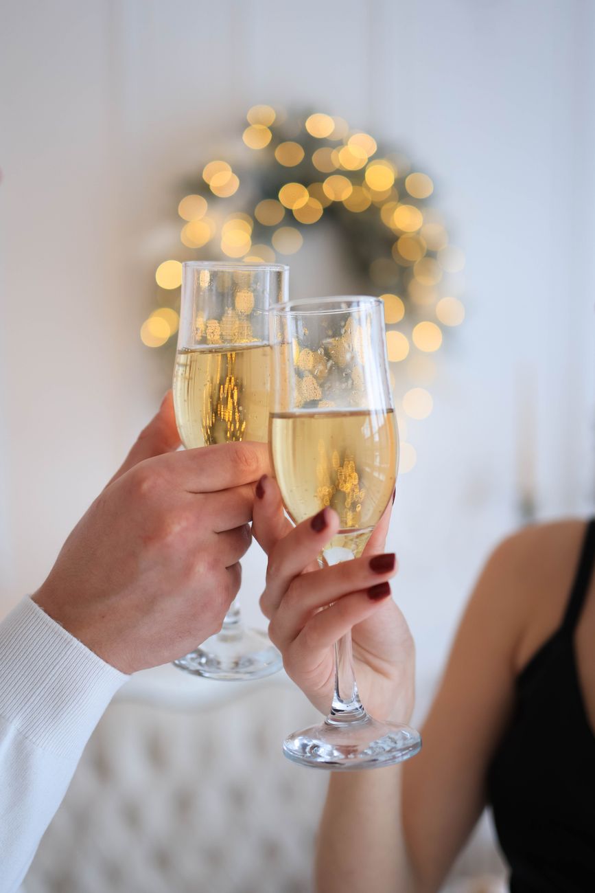 Champagne glasses raised in a toast