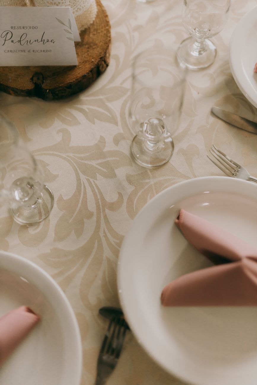A folded napkin and calligraphed place card at a setting