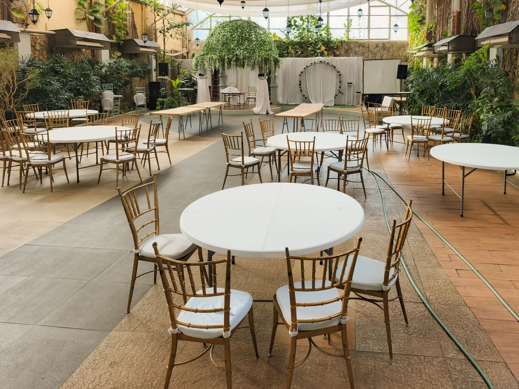 Chiavari and cross-back chairs set for a reception